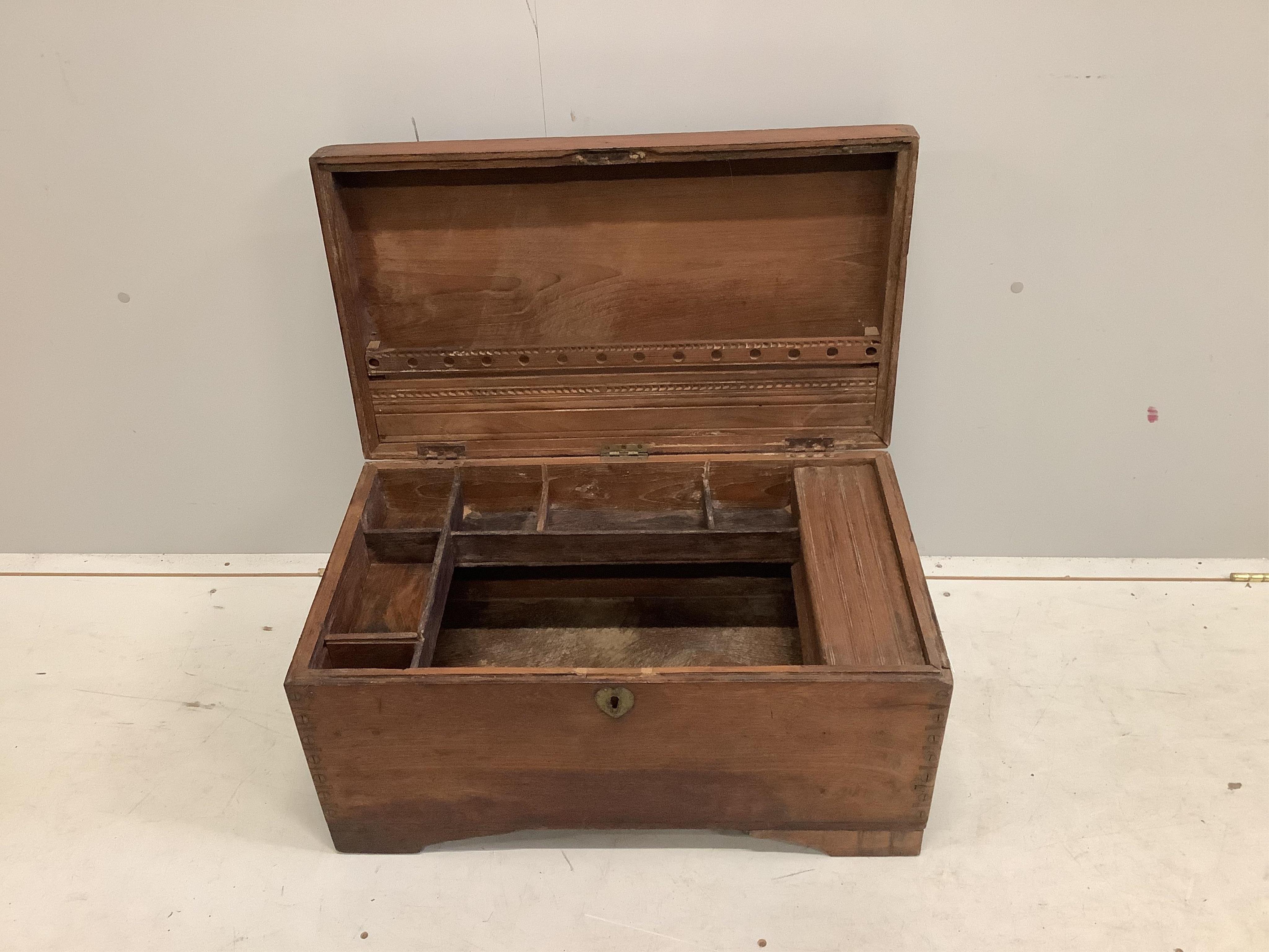 A small Anglo Indian hardwood trunk with fitted interior, width 69cm, depth 39cm, height 34cm. Condition - fair